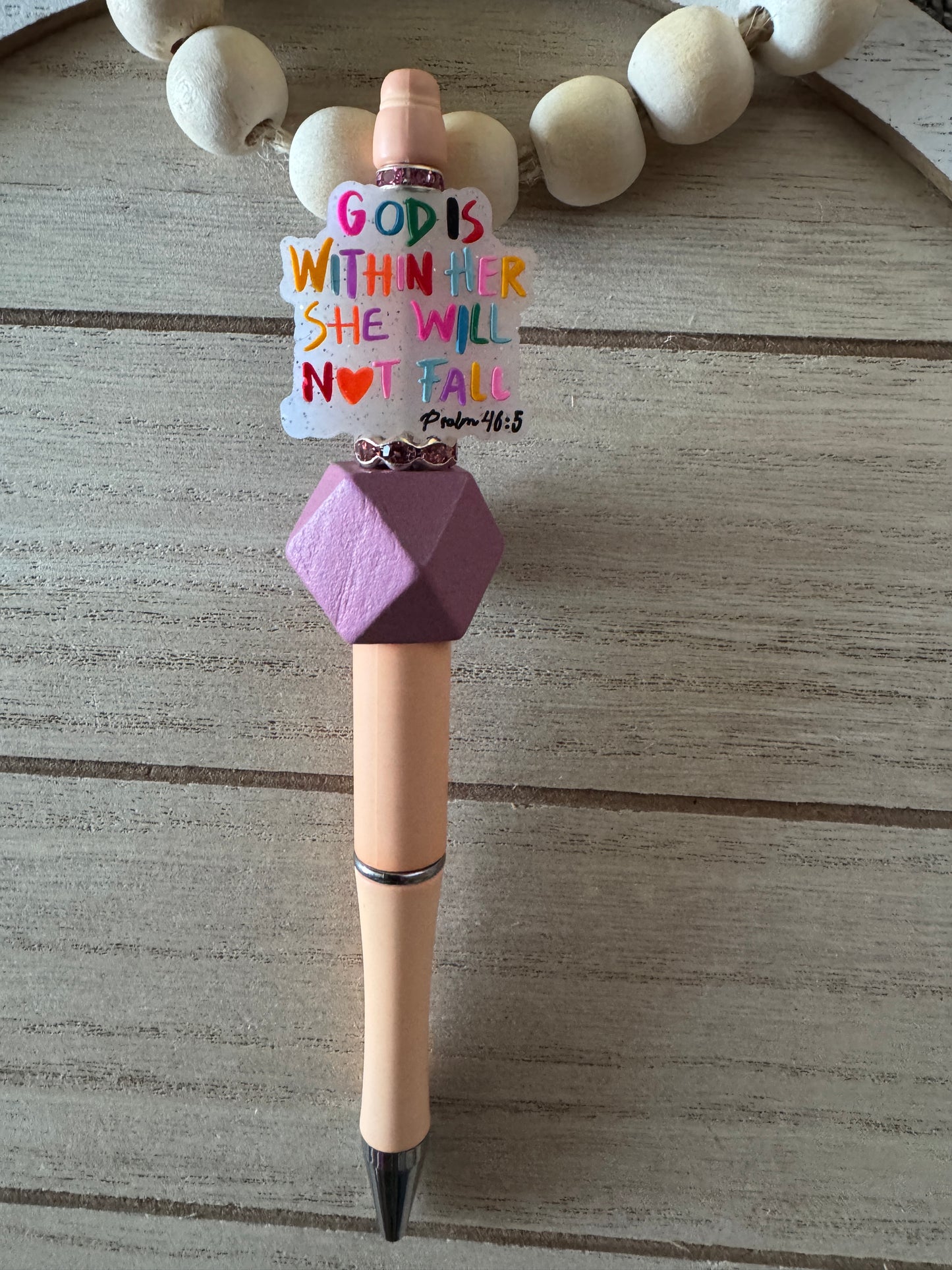 God is within her colorful Beaded Pen