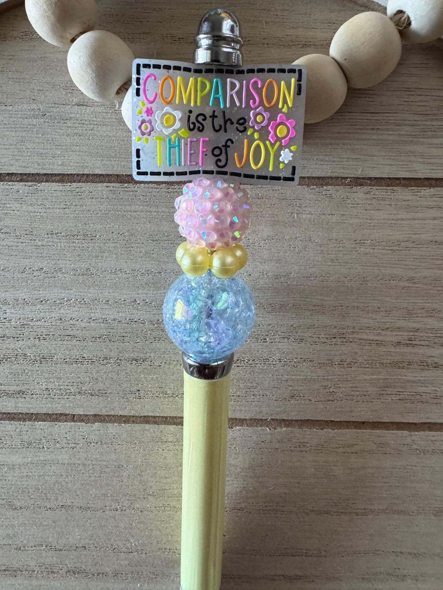 Comparison beaded pen